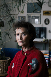 Portrait of senior woman in sweater at home