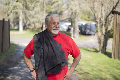 Portrait of smiling man standing outdoors