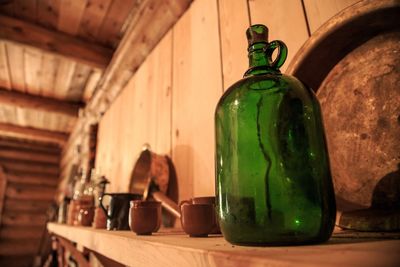 Close-up of green bottles on table