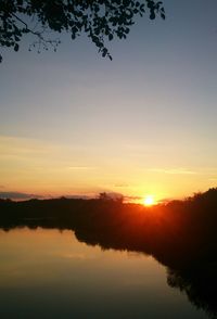 Scenic view of lake at sunset