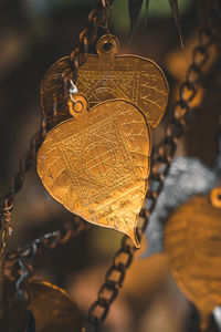 Close-up of heart shape hanging on metal
