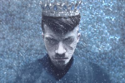 Close-up portrait of a young man in swimming pool