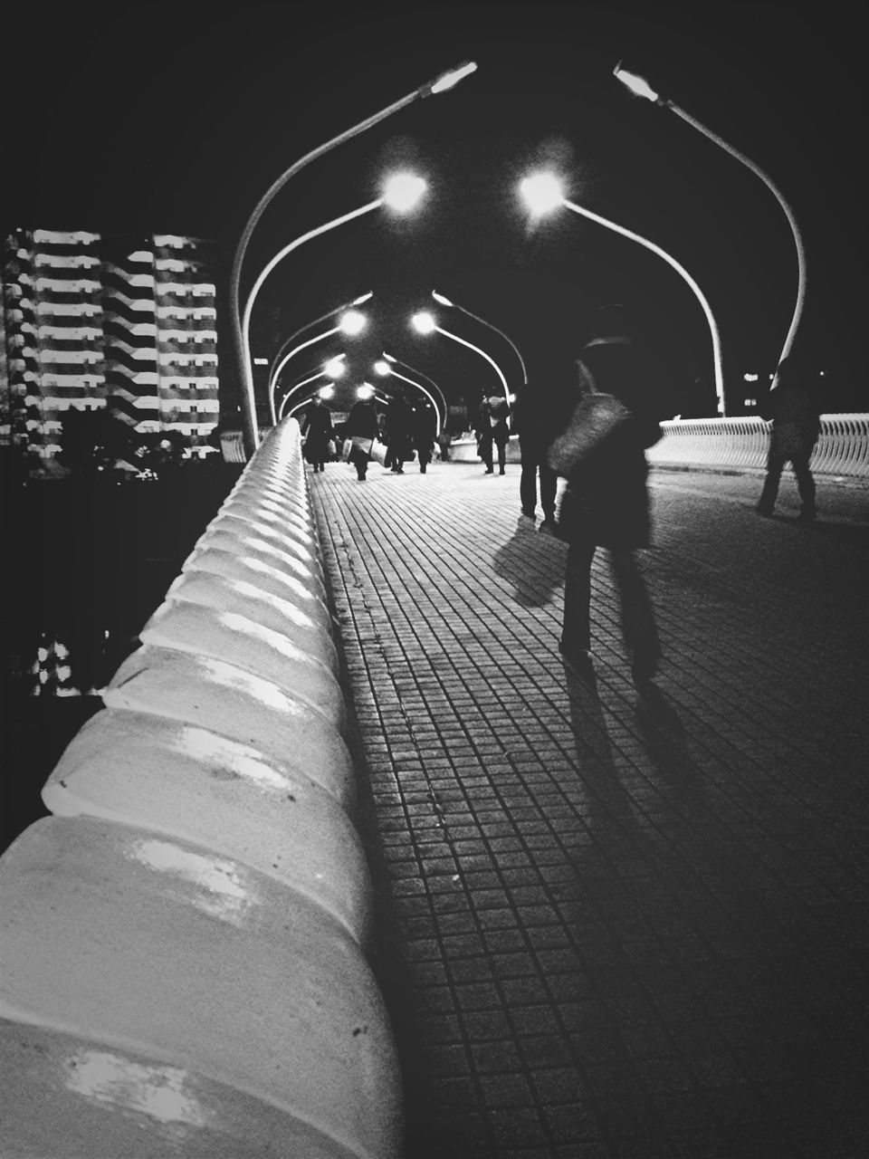 illuminated, night, the way forward, walking, men, lifestyles, architecture, rear view, full length, built structure, person, steps, leisure activity, lighting equipment, tunnel, unrecognizable person, diminishing perspective, steps and staircases