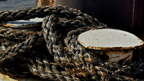 Close-up of rope tied on wood