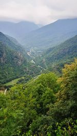 High angle view of green landscape against sky