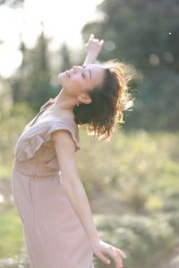 Side view of woman dancing outdoors