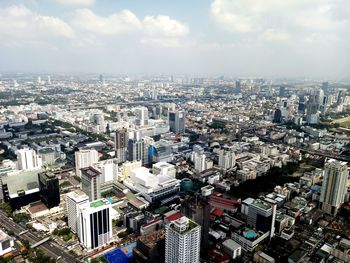 High angle view of city buildings against sky