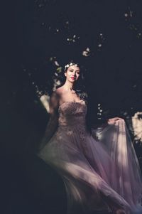 Portrait of beautiful woman wearing dress