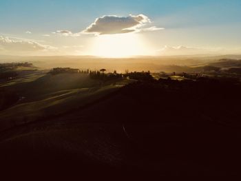 Scenic view of landscape against sky during sunset