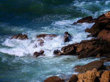 Scenic view of rocks in sea