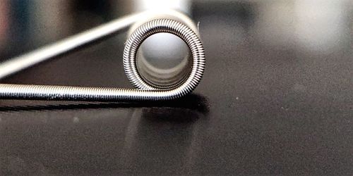 High angle view of spiral metal on table