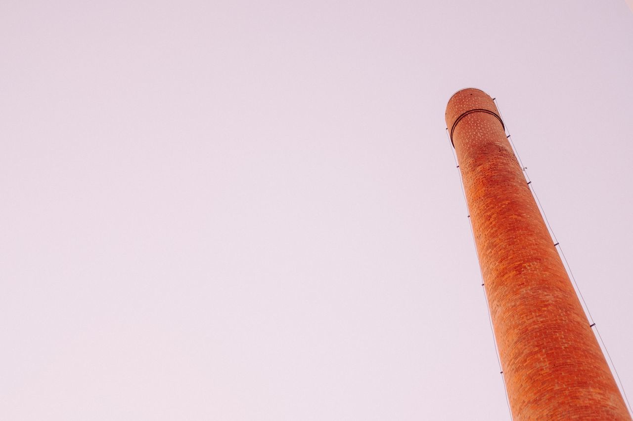 LOW ANGLE VIEW OF SMOKE STACKS AGAINST SKY