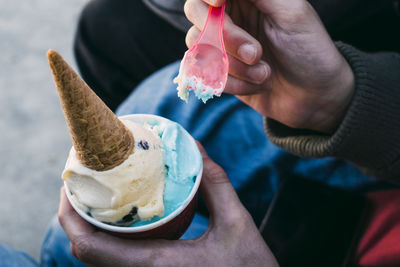 Midsection of woman holding ice cream