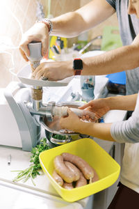 Midsection of man preparing food