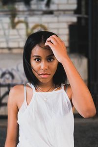 Portrait of young woman standing