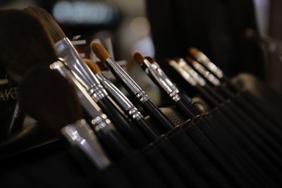 Close-up of make-brushes on table