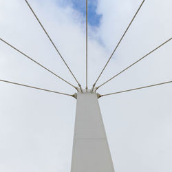 Low angle view of communications tower against sky