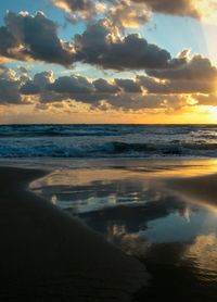 Scenic view of sea against cloudy sky