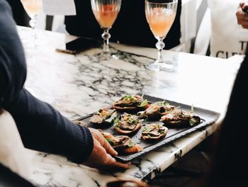 High angle view of person preparing food on table