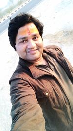 Portrait of young man standing outdoors