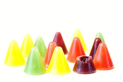 Close-up of multi colored pencils over white background