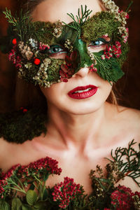 Close-up portrait of woman with flowers