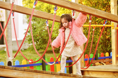 Full length of girl playing on field