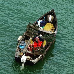 High angle view of woman floating on sea