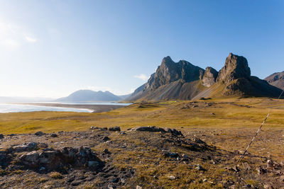 Scenic view of rocky mountains against clear sky