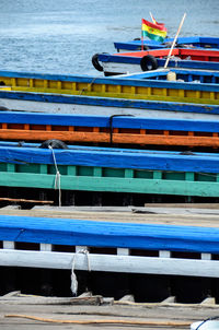 High angle view of colorful boats moored on lake