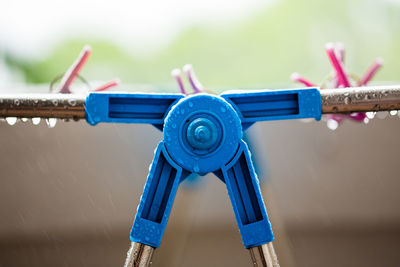 Close-up of clothespins on rope