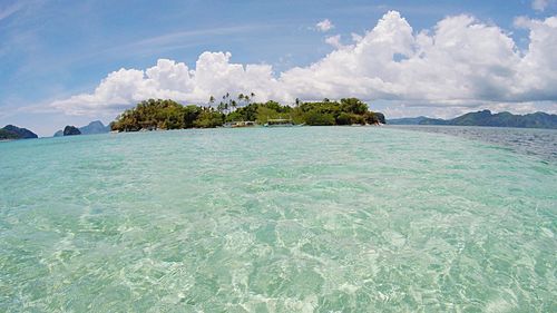 Scenic view of sea against cloudy sky