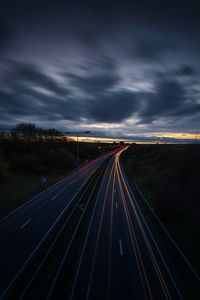 Light trails on highway at dusk