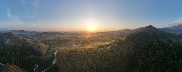 Scenic view of landscape against sky during sunset