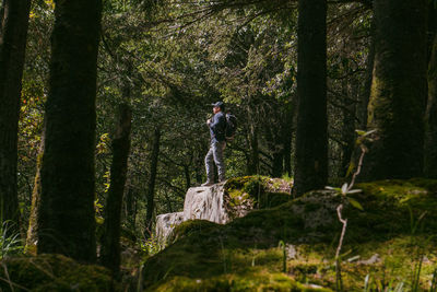 Man standing in forest