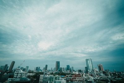 Modern buildings in city against sky