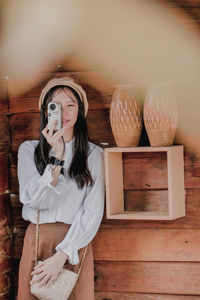 Portrait of woman standing at home