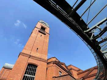 Low angle view of clock tower against sky