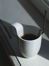 High angle view of coffee cup on table