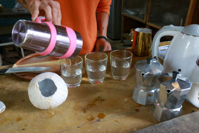 Midsection of person preparing food in kitchen