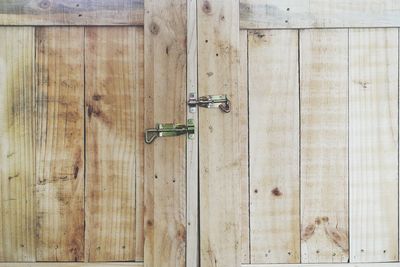 Close-up of padlock on metal door