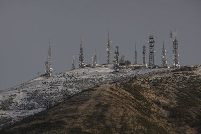 Smoke stacks against clear sky