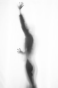 Shadow of woman over white background