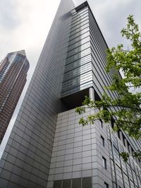 Low angle view of office building against sky