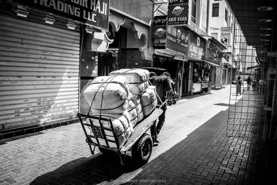 Rear view of man on motorcycle on road