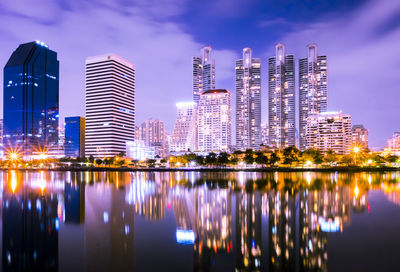 Reflection of buildings in city at night