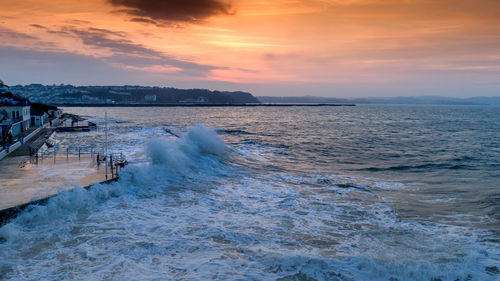 Scenic view of sea against sky during sunset