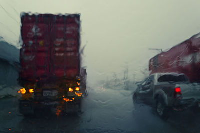 Wet car on street during rainy season