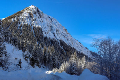 Snow covered mountain against sky