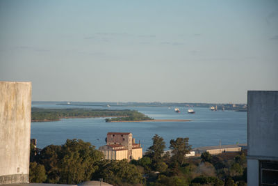 Scenic view of sea and buildings against sky